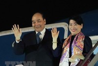 Chủ tịch nước Nguyễn Xuân Phúc và phu nhân. (Ảnh: Thống Nhất/TTXVN).