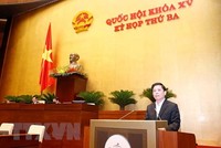 Bộ trưởng Bộ Giao thông vận tải Nguyễn Văn Thể trình bày Tờ trình tổng kết, đánh giá tổng thể tình hình thực hiện Nghị quyết số 66/2013/QH13 và kế hoạch triển khai dự án đường Hồ Chí Minh giai đoạn tiếp theo. (Ảnh: Doãn Tấn/TTXVN).