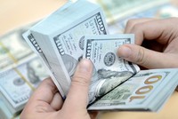 Người nước ngoài 'rửa' 100.000 USD ở Sài Gòn