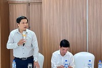 TS. Trần Minh Sơn, Trưởng Văn phòng Chương trình hỗ trợ pháp lý liên ngành cho doanh nghiệp nhỏ và vừa, Bộ Tư pháp trình bày tại Hội thảo (ảnh: M.M)