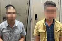 Đối tượng Bùi Minh Ngọc (trái), Nguyễn Trung Sáng. (Ảnh: TTXVN phát)