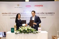Bà Nguyễn Thị Trà My, Tổng giám đốc Tập đoàn PAN và ông Yen Gunadi, đại diện Ban Lãnh đạo Momogi Group ký biên bản hoàn tất giao dịch chuyển nhượng vốn tại Bibica.