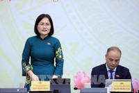 Bà Trần Thị Kim Nhung, Ủy viên hoạt động chuyên trách tại Ủy ban Pháp luật và Tư pháp của Quốc hội trả lời tại họp báo - Ảnh: TTXVN