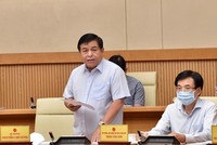 Bộ trưởng Bộ Kế hoạch và Đầu tư Nguyễn Chí Dũng báo cáo về tình hình triển khai Luật Quy hoạch - Ảnh VGP