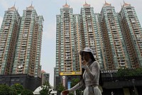 Chuyên gia của Moody’s Investor Service cho rằng, vấn đề đáng lo ngại là nền kinh tế Trung Quốc đang tăng trưởng chậm lại do sự suy thoái của ngành bất động sản nước này. Ảnh: AFP