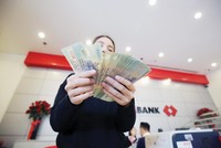 Theo lộ trình, tỷ lệ sử dụng vốn ngắn hạn cho vay trung, dài hạn sẽ về 34% từ đầu tháng 10/2022. Ảnh: Dũng Minh 