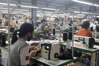 Nhiều doanh nghiệp trong cơn khát vốn do ngân hàng cạn room tín dụng. (Ảnh: Vietnam+)