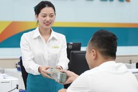 Chủ trương của Ngân hàng Nhà nước là các ngân hàng phải tiết giảm chi phí để giảm thêm lãi suất cho vay. Ảnh: Dũng Minh 