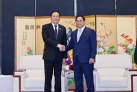 Thủ tướng Chính phủ Phạm Minh Chính gặp song phương với Thủ tướng Lào Sonexay Siphandone. Ảnh: Nhật Bắc