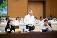 Bộ trưởng Bộ Tài chính Ngô Văn Tuấn trình bày tờ trình - Ảnh: QH.