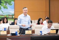  Bộ trưởng Bộ Tài chính Ngô Văn Tuấn báo cáo tại phiên họp - Ảnh: QH. 