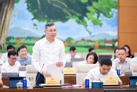 Bộ trưởng Bộ Tài chính Ngô Văn Tuấn trình bày tờ trình dự án luật - Ảnh: QH. 