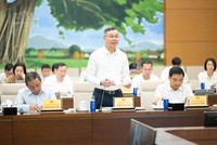 Bộ trưởng Bộ Tài chính Ngô Văn Tuấn trình bày tờ trình - Ảnh: QH.