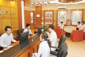 Luật Kinh doanh BĐS sửa đổi bỏ quy định bắt buộc giao dịch BĐS phải thông qua sàn giao dịch - Ảnh: Hoài Nam