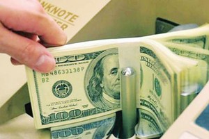 Ngân hàng ngoại cho rằng, quy định chỉ được mở một tài khoản ngân hàng gây khó cho nhà đầu tư FII