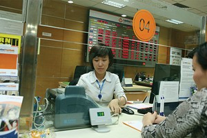 Cổ tức 2014 của LienVietPostBank là 6%, thấp hơn nhiều so với kế hoạch ban đầu