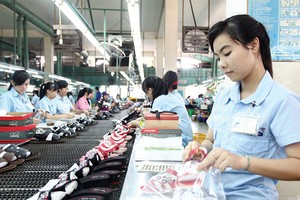 Trong cả 12 tháng năm 2014, lạm phát thực tế đều nằm trong miền dự báo của Vụ Dự báo - Thống kê - Ảnh: Lê Toàn