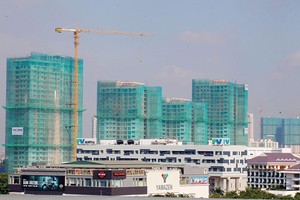 Nếu theo đúng quy định hiện hành, đa phần ngân hàng không thể đủ tiềm lực bảo lãnh nhiều dự án bất động sản.
ảnh: Lê Toàn