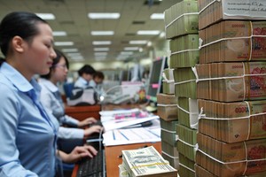 Cho vay ngắn hạn của toàn hệ thống ngân hàng hiện khoảng 2,4 triệu tỷ đồng, nếu giảm lãi suất 0,5%/năm, thì doanh thu của các ngân hàng vơi bớt 12.000 tỷ đồng