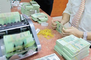 Việc xử lý nợ xấu đang nằm ngoài khả năng của những “tội đồ” là ngân hàng và doanh nghiệp. Ảnh: Đ.T