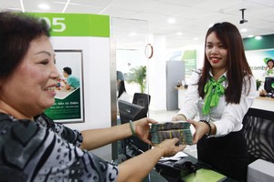 Các ngân hàng hiện ưu tiên cấp vốn cho cá nhân vay mua nhà. Ảnh: Lê Toàn