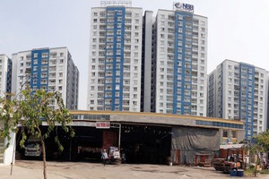 Chung cư Carina (quận 8, TP.HCM) có gắn thương hiệu NBB, nhưng khi vụ cháy xảy ra, Công ty NBB phủ nhận vai trò chủ đầu tư. Ảnh: Việt Dũng