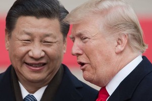 Chủ tịch Trung Quốc - Tập Cận Bình và Tổng thống Mỹ - Donald Trump tại Bắc Kinh. Ảnh: AFP.