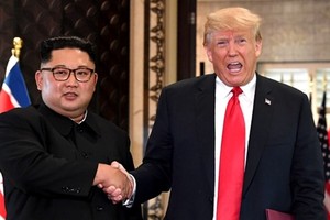 Tổng thống Mỹ Trump và lãnh đạo Triều Tiên Kim Jong-un tại Singapore tháng 6 năm ngoái. Ảnh: AFP.