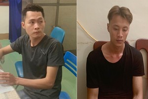 Nguyễn Thái Thành và Võ Hồng Quang tại cơ quan công an. Ảnh: Đại Hiệp.