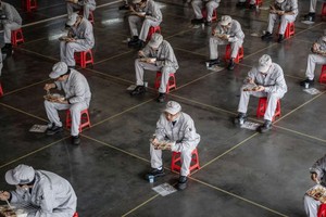 Đa số doanh nghiệp tại Trung Quốc đã nối lại hoạt động. Ảnh: STR/AFP.