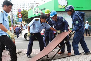 Lực lượng thanh tra xây dựng đô thị ở TP HCM sẽ được sáp nhập về một mối, do UBND cấp quận huyện quản lý. Ảnh: Hữu Công.