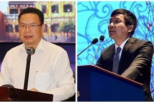 Thứ trưởng Bộ Ngoại giao Nguyễn Minh Vũ (phải) và Thứ trưởng Bộ Lao động - Thương binh và Xã hội Lê Văn Thanh (trái).