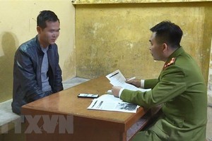 Đối tượng tại cơ quan điều tra. (Ảnh: Đinh Văn Nhiều/TTXVN).