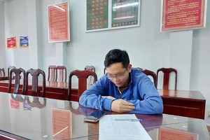 H. tại cơ quan công an. (Nguồn: TTXVN phát).