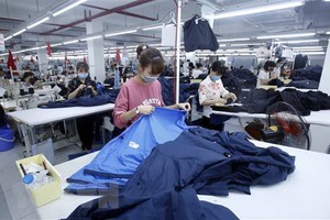 Sản xuất hàng dệt may. (Nguồn: TTXVN).
