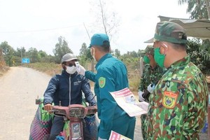 Lực lượng biên phòng phòng, chống dịch bệnh trên vùng biên giới. (Ảnh minh họa: Văn Khương/TTXVN).