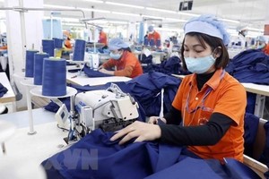 Sản xuất hàng dệt may. (Nguồn: TTXVN).