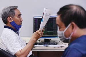 Thị trường chứng khoán luôn rất nhạy cảm với thông tin. Ảnh: Dũng Minh.