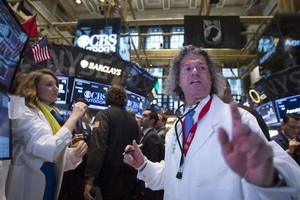 Phố Wall tăng mạnh sau bài phát biểu của Chủ tịch FED - Ảnh: Reuters