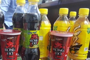 Chì vượt ngưỡng, thu hồi 3 lô nước C2, Rồng đỏ