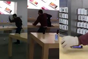 Hình ảnh người đàn ông phá hoại hàng chục iPhone được ghi lại.