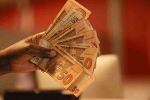 Zimbabwe tung ra đồng nội tệ mới được hỗ trợ bởi vàng