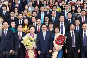 Thủ tướng Chính phủ Phạm Minh Chính gặp gỡ các doanh nghiệp, doanh nhân tiêu biểu hôm 12/12/2021 (Ảnh: TTXVN)