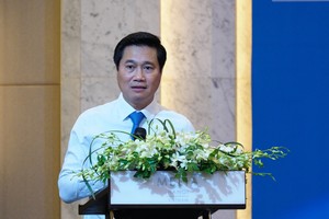 Thứ trưởng Bộ Xây dựng Nguyễn Tường Văn phát biểu chỉ đạo Hội thảo sáng 13/7 (Ảnh: M.MInh)