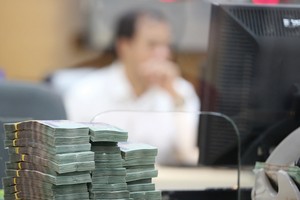 Quá trình xử lý nợ xấu diễn ra chậm ở nhiều ngân hàng. Ảnh: Dũng Minh