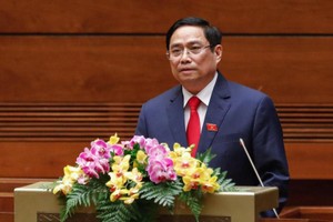 Thủ tướng Phạm Minh Chính trình Quốc hội xem xét phê chuẩn đề nghị miễn nhiệm một số thành viên Chính phủ nhiệm kỳ 2016 - 2021 (Ảnh Duy Linh) 