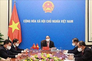 Chủ tịch nước Nguyễn Xuân Phúc khẳng định, Việt Nam coi trọng phát triển quan hệ láng giềng hữu nghị, đối tác hợp tác chiến lược toàn diện với Trung Quốc. (Ảnh TTXVN)