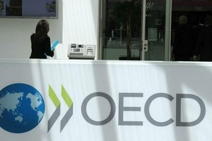 Cho đến nay, hơn 130 quốc gia đã cùng tuyên bố thiết lập khuôn khổ mới về cải cách thuế quốc tế của OECD, trong khi một số quốc gia được cho là vẫn bảo lưu quan điểm riêng với các điều khoản trong thỏa thuận. Ảnh: AFP