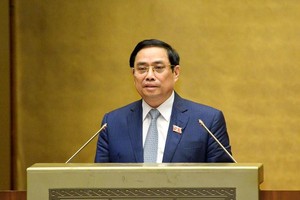 Thủ tướng Phạm Minh Chính trình bày tờ trình về cơ cấu tổ chức của Chính phủ nhiệm kỳ Quốc hội khóa XV. (Ảnh Quochoi.vn).