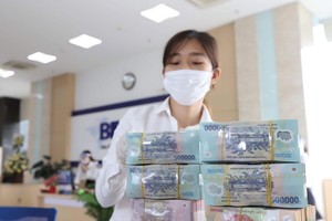 Nợ xấu tiềm ẩn đang tăng và lợi nhuận ngành ngân hàng chịu áp lực giảm. Ảnh: Dũng Minh